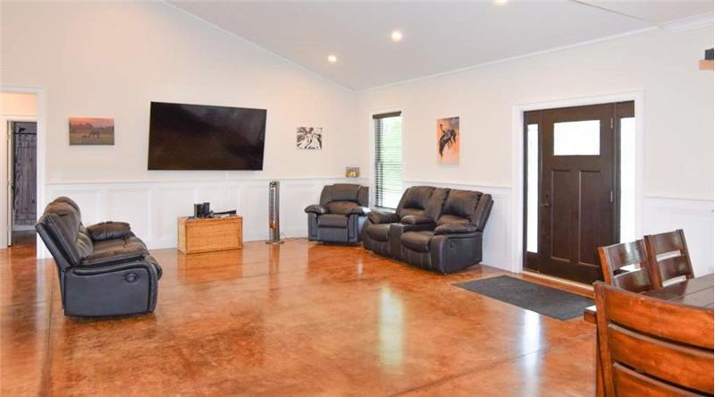 Living room with  stained concrete flooring