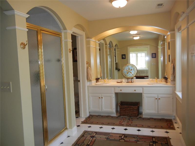 Well appointed master bath with ceramic tiled floor....