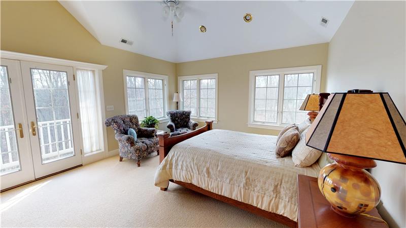 Master suite in the back of the home takes advantage of the breathtaking lot, natural light, and landscaping!