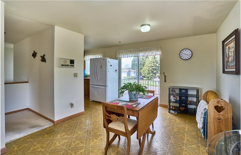 Another View of the Large Dining Room with Access to the Upstairs Deck Through the Sliding Glass Door.