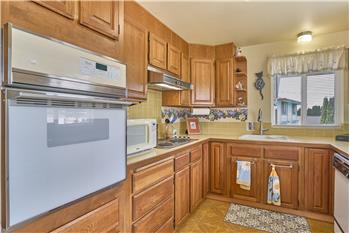 Chef's Kitchen with Tile Backsplash.
