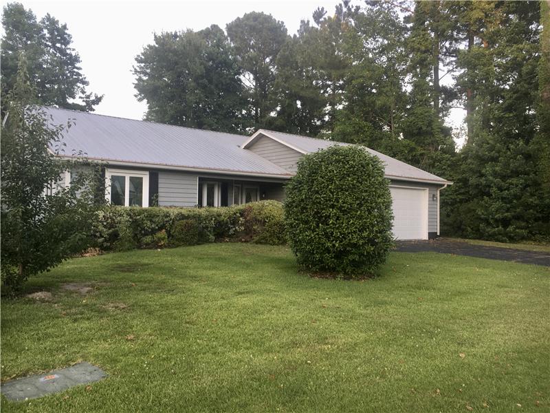 Both front entry and garage have Handicapped Accessible Ramps