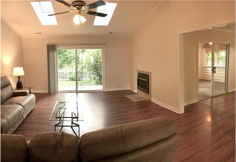 Spacious Living Room with Vaulted Ceilings and Skylights