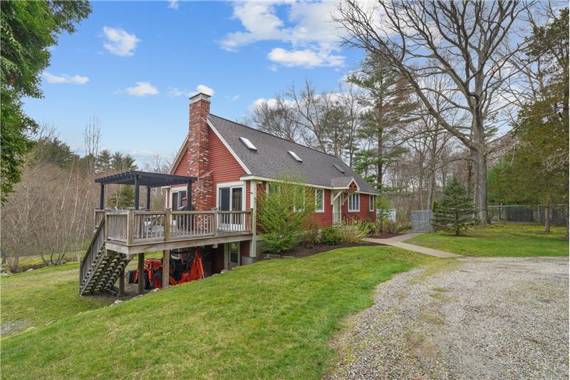 Deck overlooks rolling hills and ponds