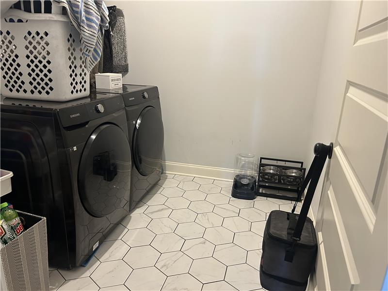 Laundry area just off the garage, near the kitchen