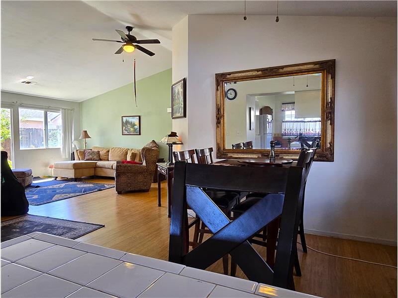 Sunfilled kitchen with eastern exposure opening to dining and living areas.