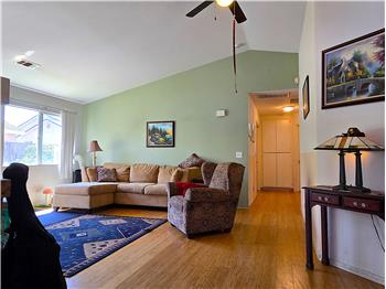 Lightfilled living area with vaulted ceilingsgreat for relaxing or entertaining.