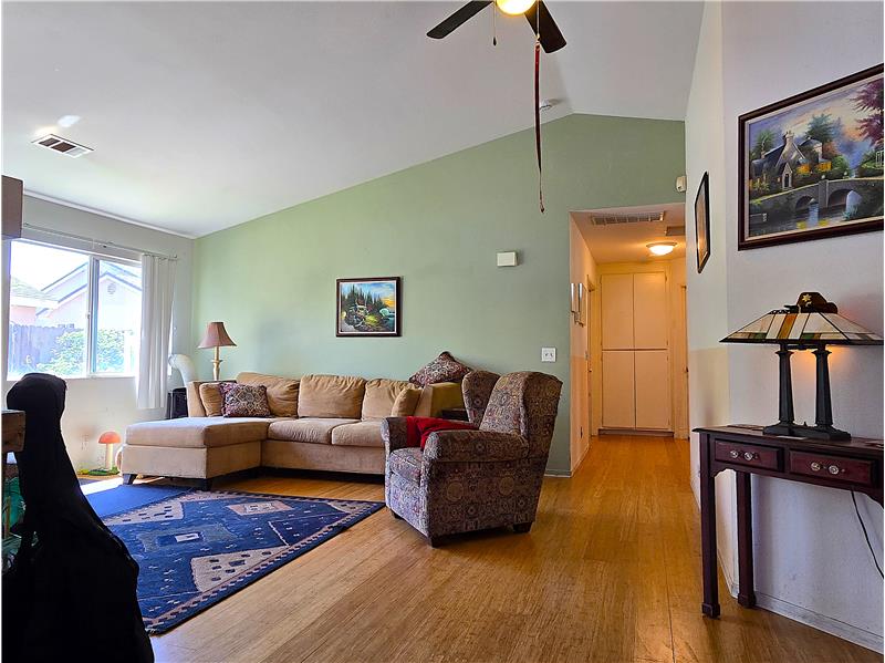 Lightfilled living area with vaulted ceilingsgreat for relaxing or entertaining.