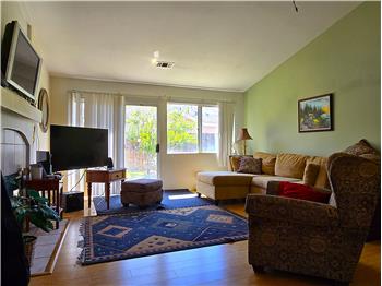 Bright living room with generous natural light for evenings or gatherings.