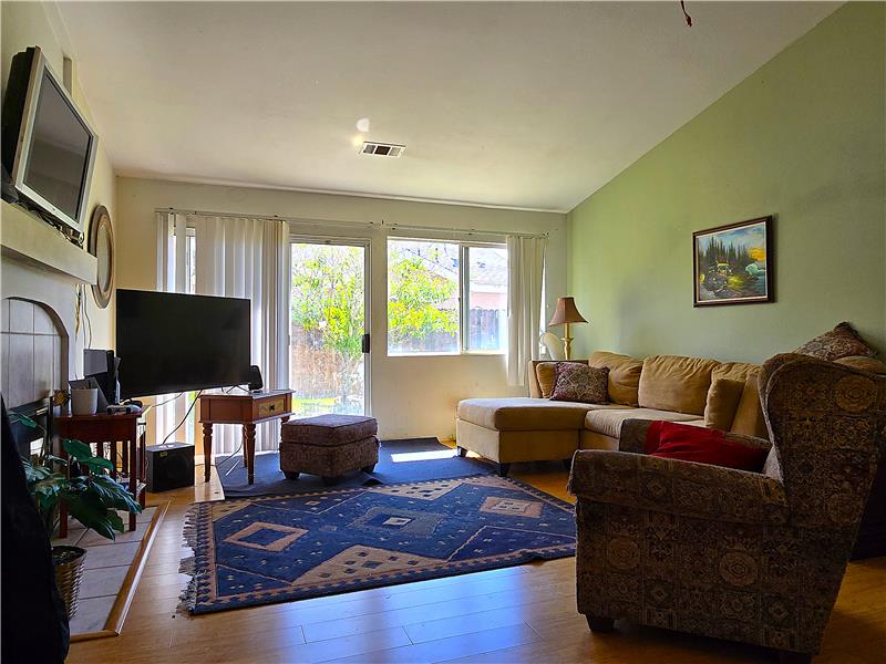 Bright living room with generous natural light for evenings or gatherings.