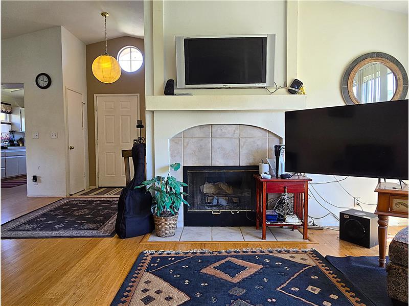 Warm living area with fireplace in a highly desirable gated Santa Maria community.