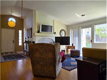 Cozy living space with fireplace and abundant natural light yearround.