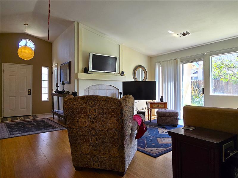 Cozy living space with fireplace and abundant natural light yearround.