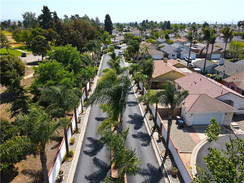Gated entry with palmlined boulevard and direct access to nearby Preisker Park.