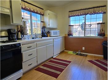 Wake up to warm natural light pouring into a kitchen designed for slow mornings and easy routines.