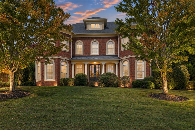 Welcome to 2309 Highland Forest Drive in Waxhaw, NC.  Full brick home framed by mature trees and established landscaping.