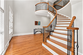 Grand 2-story foyer with sweeping staircase welcomes you inside.