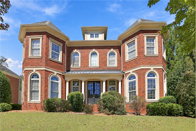 Beautifully balanced, undeniably impressive. Expansive facade hints at the 5,400+ square feet and three finished levels inside.