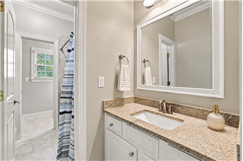 Jack & Jill bathroom with private, granite topped vanity.