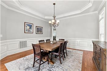 Large formal dining room made for celebrations, holiday dinners. Extensive millwork, trey ceiling gives the room a custom feel.