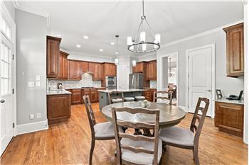 Breakfast area easily accommodates a full-size table. Ideal for daily meals, casual entertaining, family game night.