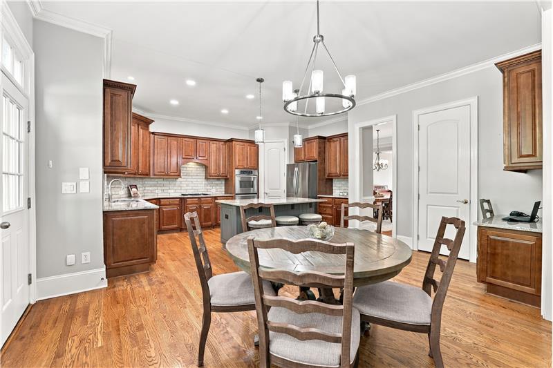 Breakfast area easily accommodates a full-size table. Ideal for daily meals, casual entertaining, family game night.
