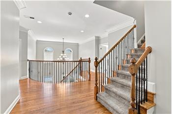 Second floor landing continues the home's impressive architectural style. More than a hallway between bedrooms.
