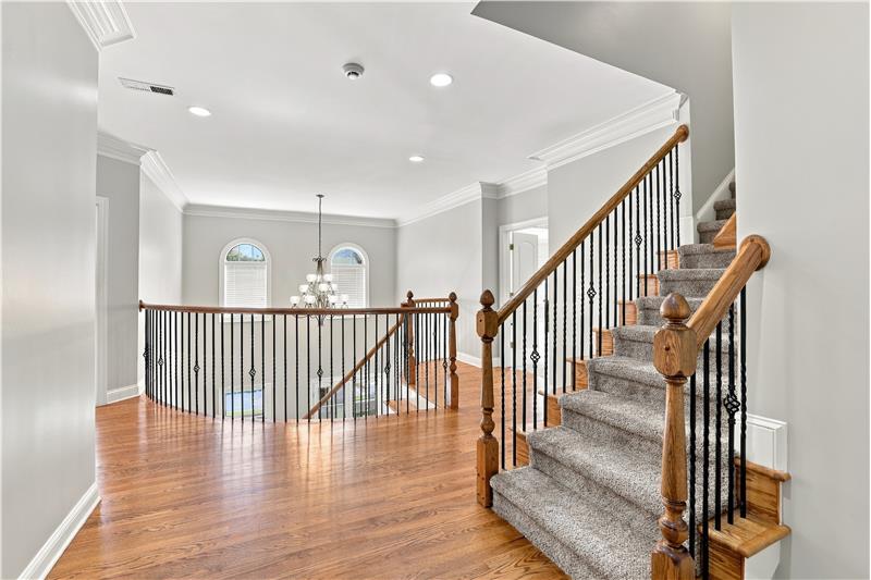 Second floor landing continues the home's impressive architectural style. More than a hallway between bedrooms.