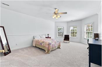One of four additional bedrooms on home's second floor. Spacious room with bay window.