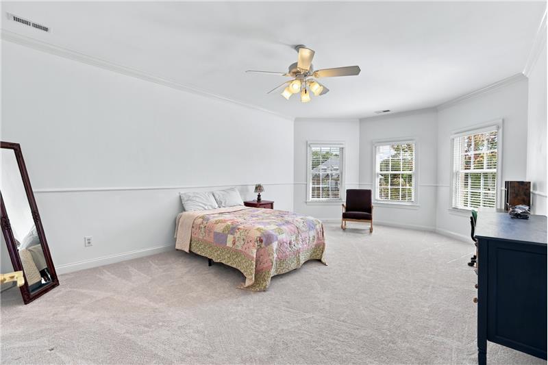 One of four additional bedrooms on home's second floor. Spacious room with bay window.