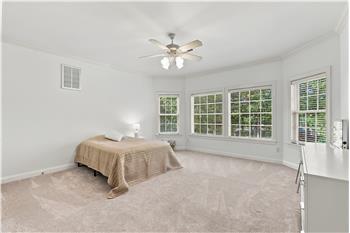 One of four additional bedrooms on home's second floor. One of two large bedrooms with a bay window.