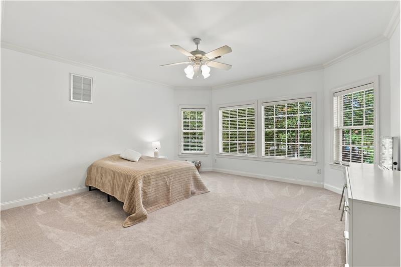 One of four additional bedrooms on home's second floor. One of two large bedrooms with a bay window.