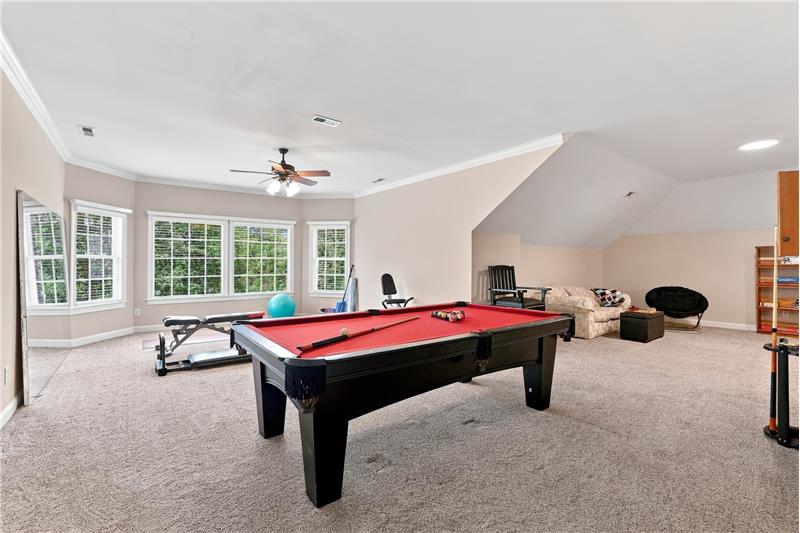 Finished third floor offers amazing flexibility to how the space in this home can be used. Currently a recreation/home gym area.