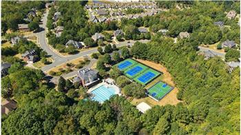 Aerial view of Weddington Chase's amenities: clubhouse, jr olympic pool tennis, basketball, volley ball courts, and more.