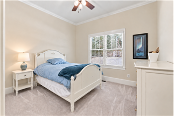 Bedroom suite with adjoining bath on home's main floor. Ideal for family or guests who can't navigate stairs.
