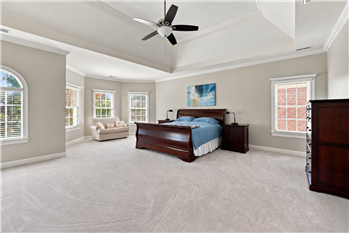 Primary suite has the size and scale you'd expect in a home of this caliber. Room for sitting area, larger furniture.