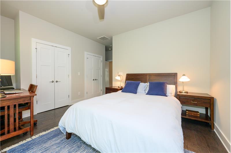 Owner's suite with hardwood floors, custom-built closets and en-suite bathroom.