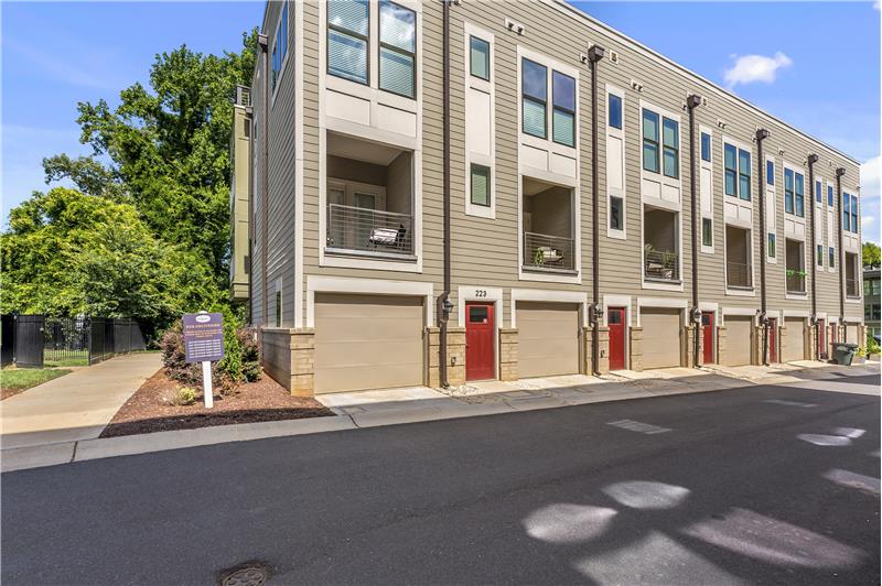 Townhome features a 2-car garage with storage accessed from the back side of the building.