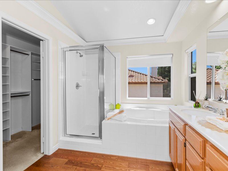 Primary bath has soaking tub and separate shower