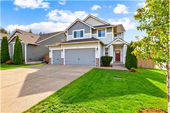 The corner-lot, 3 car garage, and fenced yard give the home a distinctive street presence.