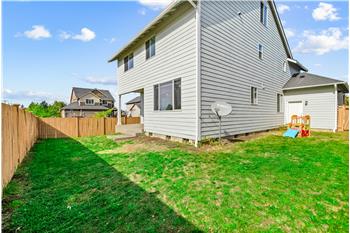 A fully fenced backyard offers added privacy and a blank canvas for landscaping.