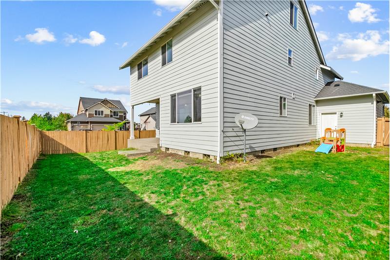 A fully fenced backyard offers added privacy and a blank canvas for landscaping.
