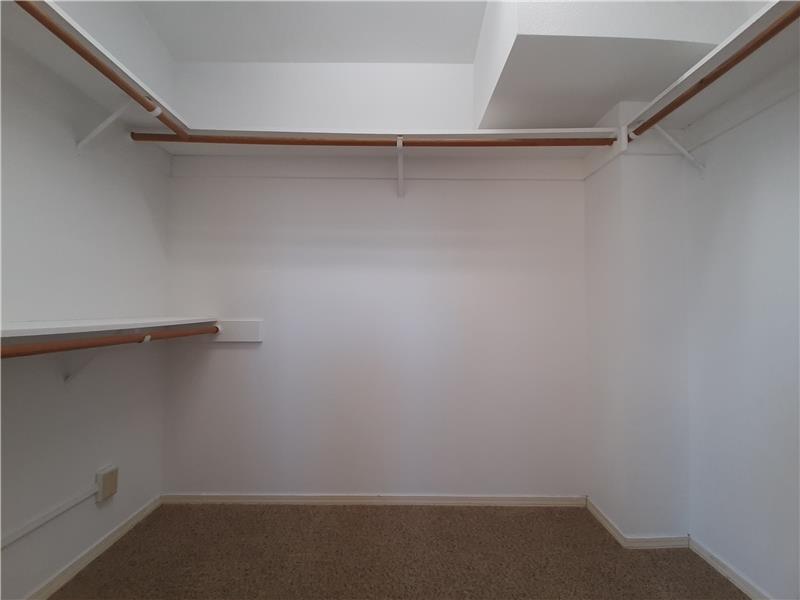 The walk-in closet of Bedroom 1. What would YOU DO with all this space?