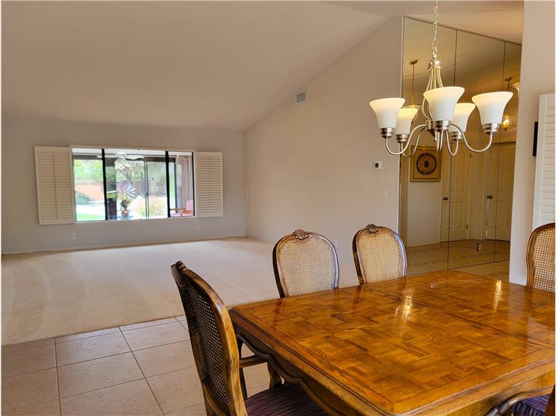 Formal Dining to Formal Living Room with views of backyard through permitted Sun Room!