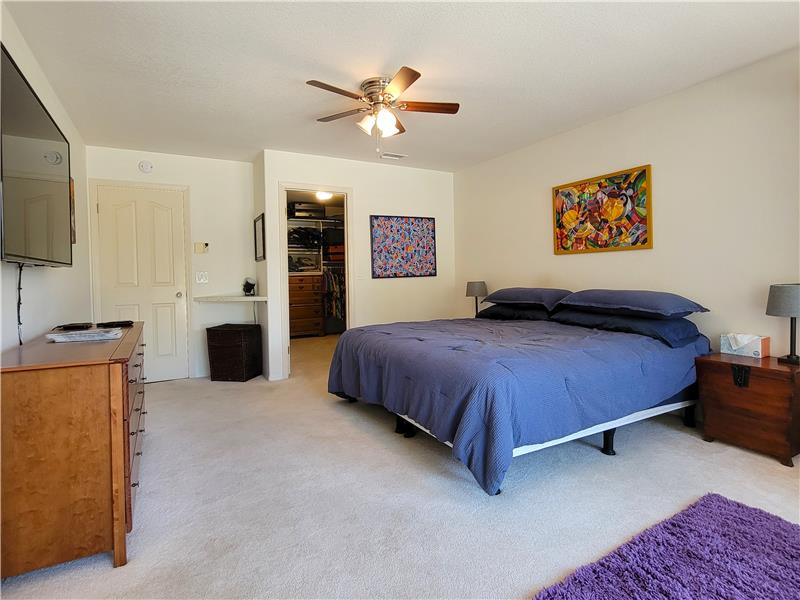 The Master Bedroom enjoys the natural light of its owns slider, of course.