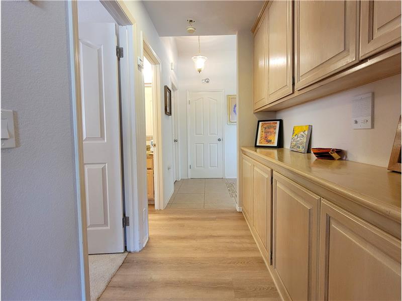 A wall of storage, tucked out of sight from main living! Coat closet is directly ahead.