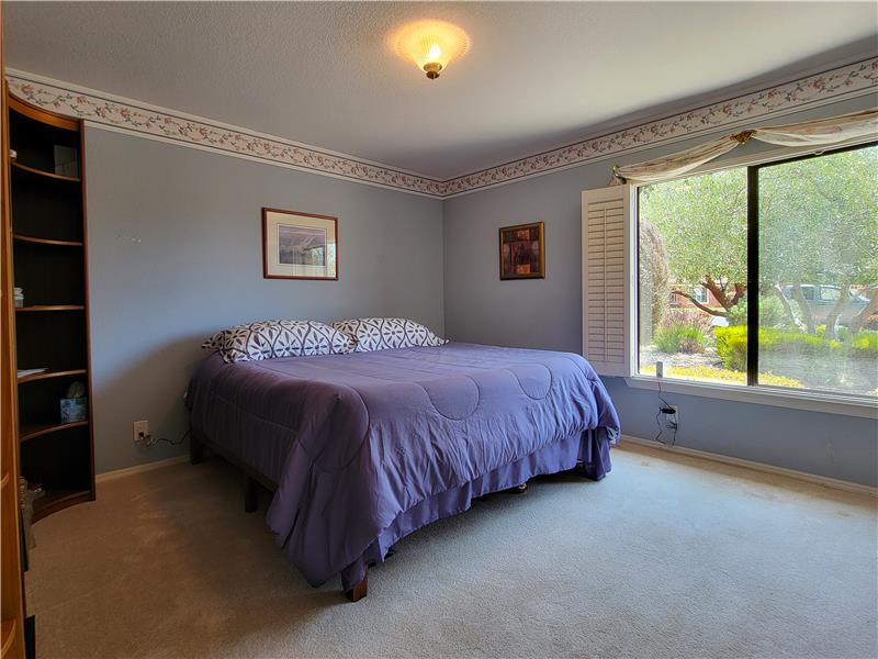 Bedroom 3, both spacious and enjoying its own walk-in closet!