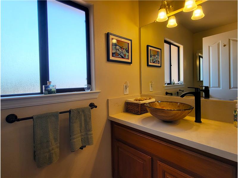 The 3rd Bath is perfectly positioned off the utility room, near the kitchen!