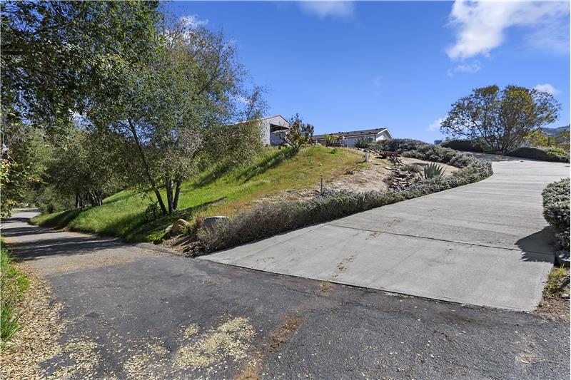 House and garage up slope from shared private driveway