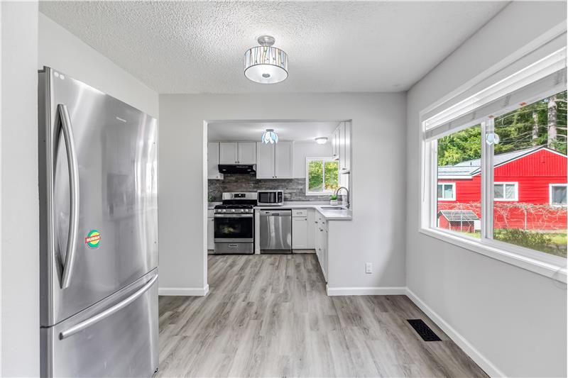 The kitchen has been updated. There is room for a small table in the kitchen area.